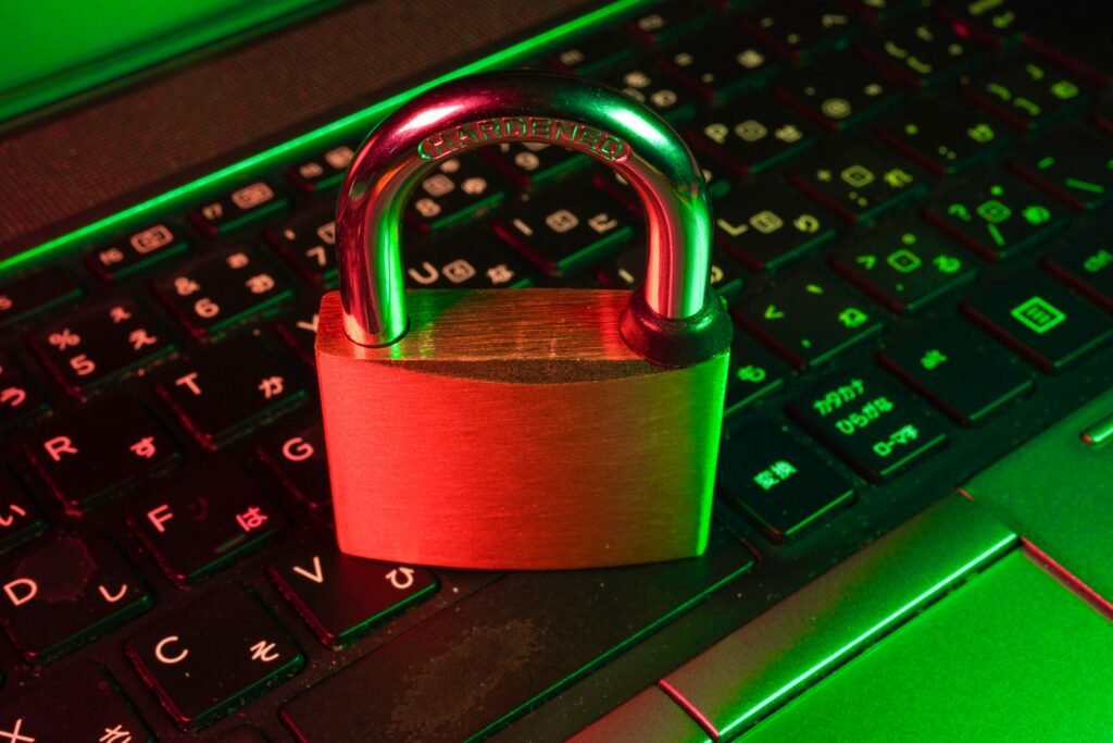 red padlock on black computer keyboard red padlock on black computer keyboard